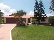 Example of a Cape Coral Gulf access waterfront home in the Cape Coral Yacht Club neighborhood behind a bridge