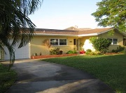 Example of a Cape Coral Gulf access waterfront home in the Cape Coral Yacht Club neighborhood behind a bridge